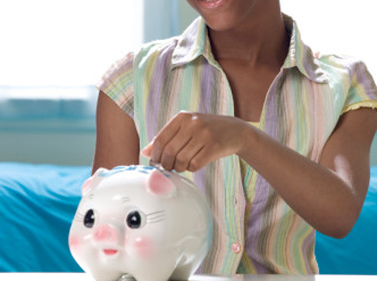 black woman with piggy bank