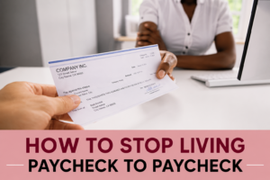 Hands exchanging a paycheck, illustrating financial stress and the struggle to stop living paycheck to paycheck.