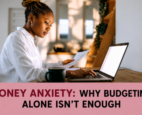 Woman reviewing financial documents beside a laptop, illustrating money anxiety and the limitations of budgeting alone.